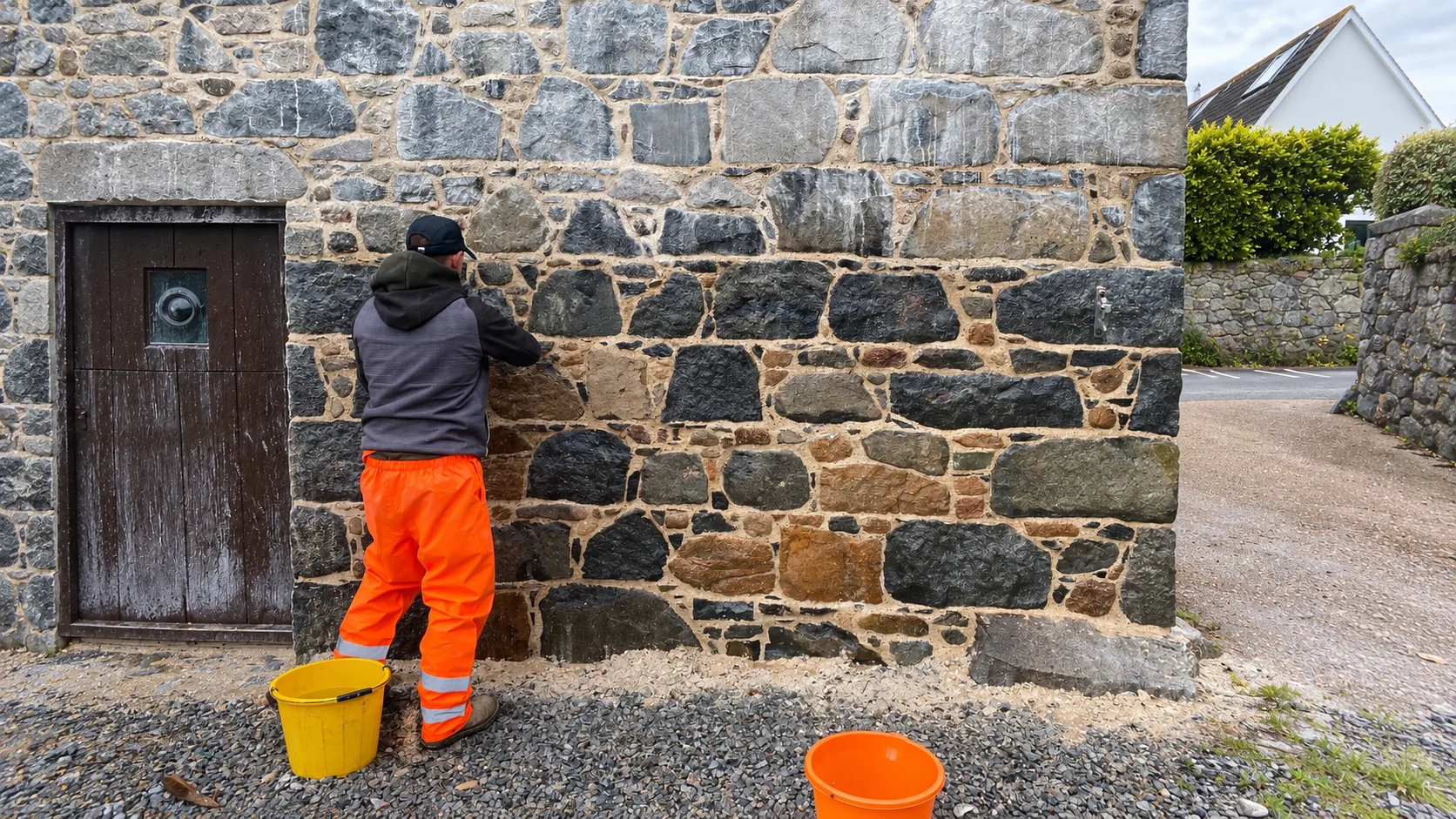 Lime pointing work on a Guernsey stone wall